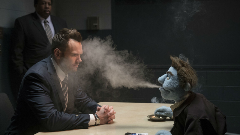 Phil gives the business to a cop played by Joel McHale.